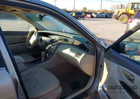 2000 Toyota Avalon Xls z USA, uszkodzony, nr VIN 4T1BF28B0YU024467